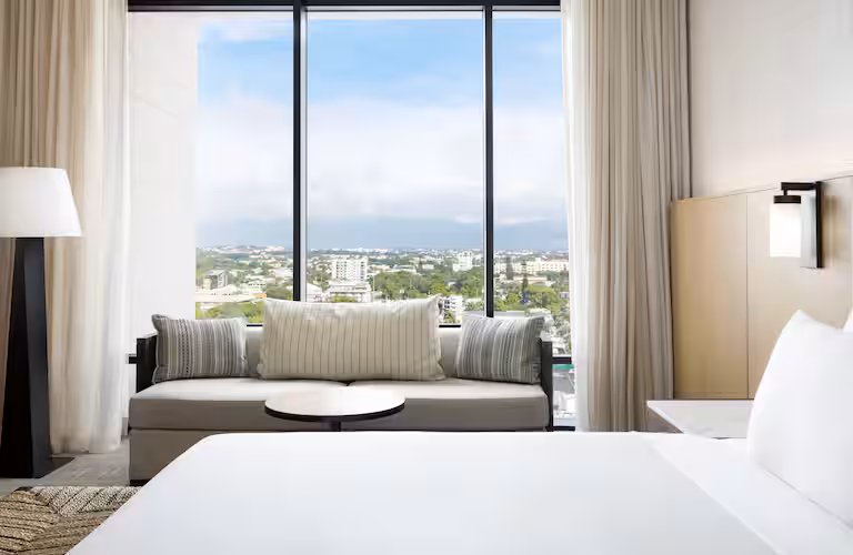 Upholstered sofa Hotel Santiago Curio Collection guest room FF&E